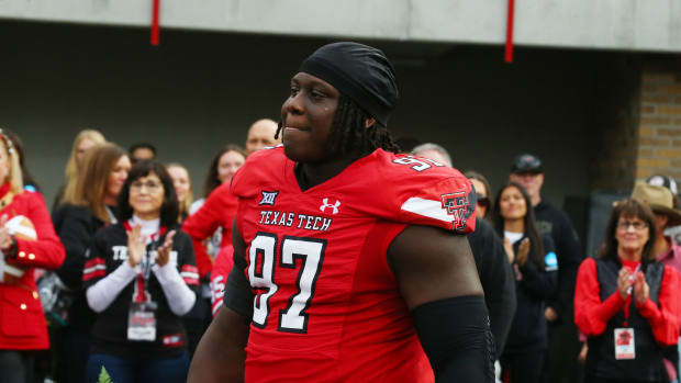 Nov 18, 2023; Lubbock, Texas, USA; Texas Tech Red Raiders senior defensive tackle Tony Bradford Jr. (97) enters the field during senior night before the game against the Central Florida Knights at Jones AT&T Stadium and Cody Campbell Field.